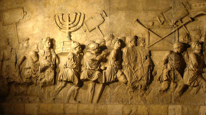 A panel from the ancient Roman Arch of Titus showing the sacking of the Temple in Jerusalem and removal of the golden menorah by Roman troops