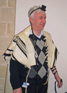 A man wearing a tallit and tefillin