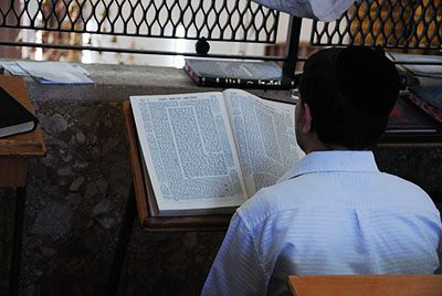 A man studying a page of Talmud